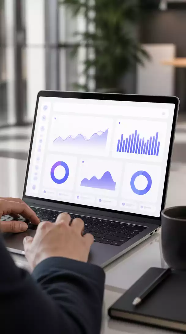Person using a laptop with a SaaS dashboard on screen, visualizing recurring revenue