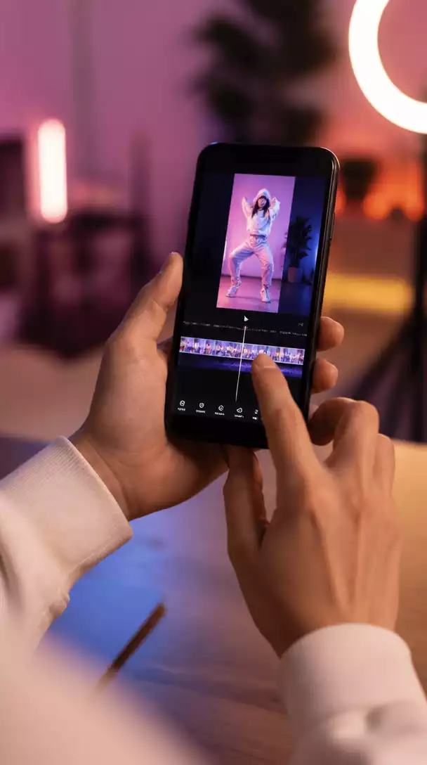Person creating short video content on a smartphone, representing TikTok marketing