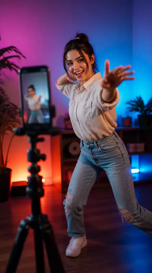 Person creating short video content on a smartphone, vibrant and dynamic background, no text, no words, no typography